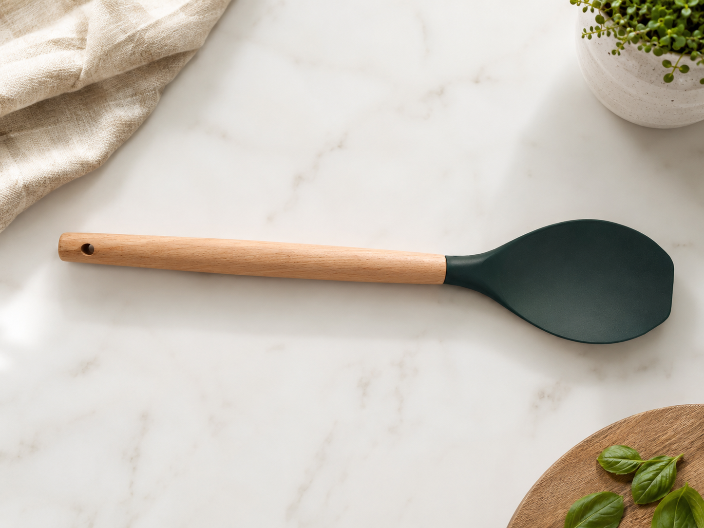 Black silicone cooking spoon with a wooden handle